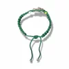 Pulsera de hilo verde con dije de San Judas Tadeo