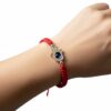 Pulsera de hilo rojo con mano de Fátima y ojo turco