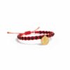 Pulsera tejida: Elegancia, brillo y la medalla de San Benito