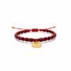Pulsera tejida: Elegancia, brillo y la medalla de San Benito