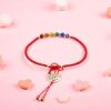 Pulsera artesanal roja: Árbol y la vida y chaquira multicolor