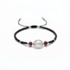 Pulsera de chaquira negra y San Benito: Poder, elegancia y blindaje absoluto