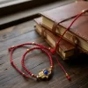 Pulsera de chaquira roja: Triple protección con mano de Fátima, ojo turco