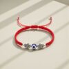 Pulsera de doble poder: Hamsa gemela, ojo turco y la fuerza del rojo