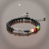 Pulsera de devoción: Santa Muerte, protección en negro mate y el poder de todos los colores (las siete potencias)