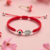 Pulsera de doble protección: San Benito, ojo turco y la energía del rojo